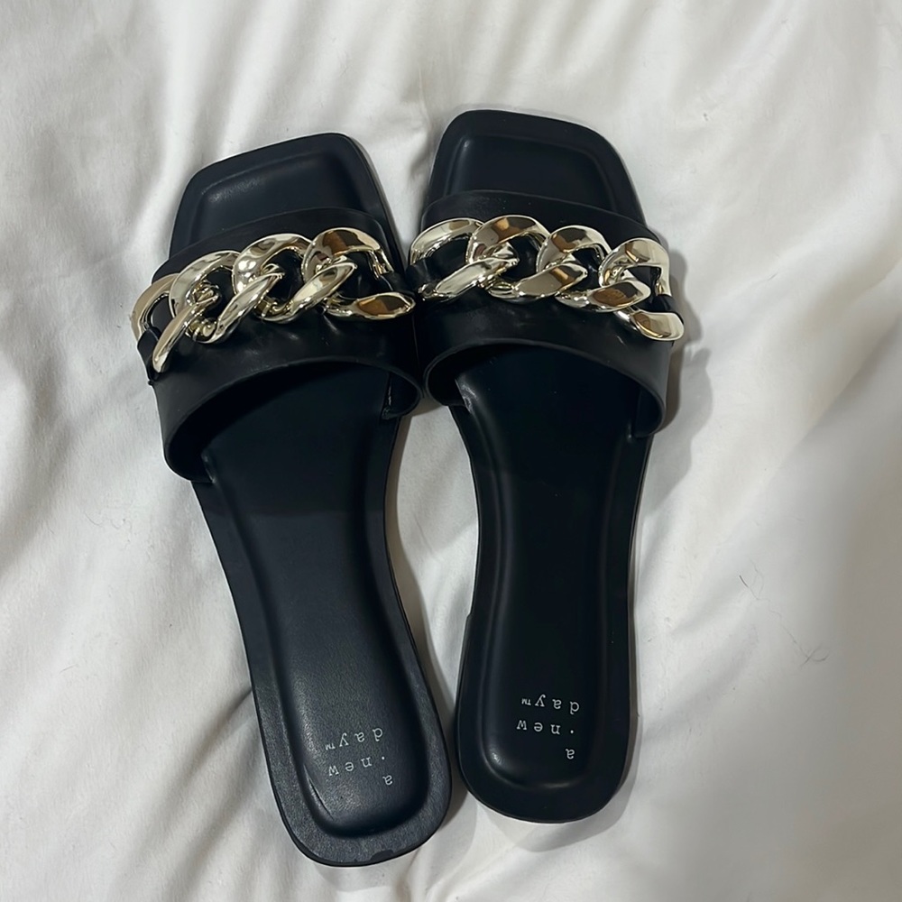 brand new. never worn black sandals with silver buckle